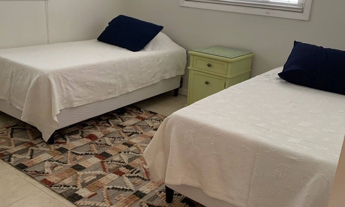 Port Pine Heights House | House 2 bedroom 2 bath Large enclosed porch overlooking canal with boat dock