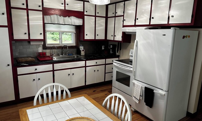 Tawas City House | Ideally located near Lake Huron Access and Bike Trail