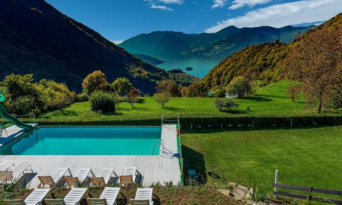 Marone Ski Chalet | In a green and relaxing atmosphere, with pool and stunning lake view.