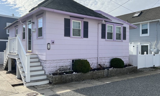 Stone Harbor House | Introducing Stone Court Cottage, a charming vacation rental available for your summer vacation