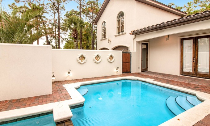 Emerald Waters Village House | Inviting home close to beach with pool, full kitchen, golf, central AC, & W/D