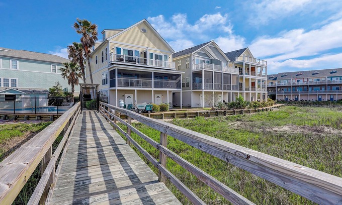 Waters Edge House | Inviting waterfront townhouse with beach access, balcony, W/D, pool & dock