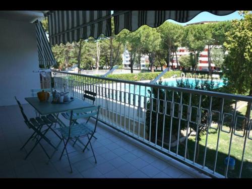 Porto Santa Margherita Apartment | Welcoming flat with charming pool view terrace