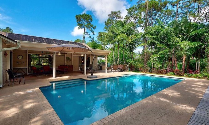 Jupiter House | Jupiter Farms Tropical Oasis with Lush Landscaping