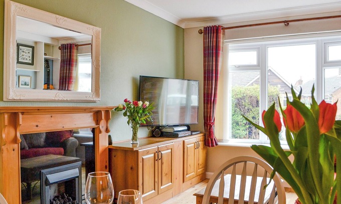 Hunmanby Cottage | Just love the sunken seating area and fire pit in the garden.