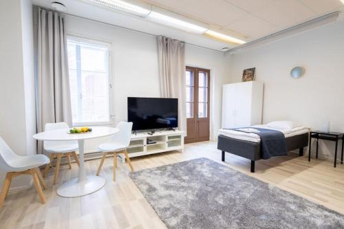 Varkaus Apartment | Keskusta sviitti parvekkeella ja pyykinpesukoneella Vanha Postitalo