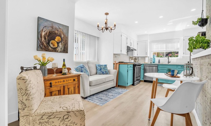 Lynn Valley House | King Bed with front door parking and private courtyard. Designed for living.