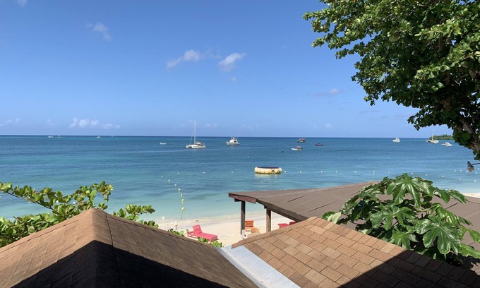 Negril Villa | King Suite at Oceanview Resort in Jamaica - Enjoy 7 miles of White Sand Beach! by RedAwning