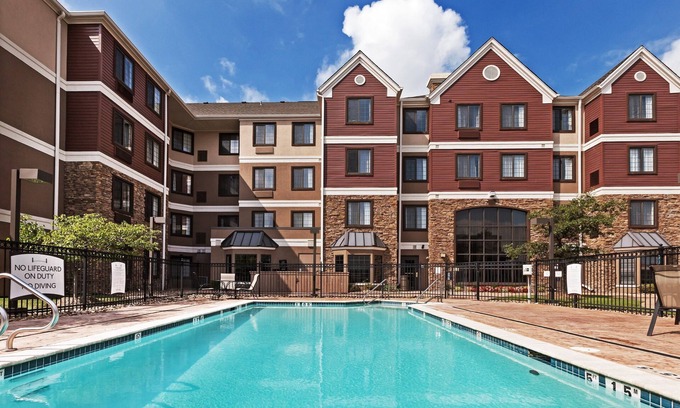 Broken Arrow Condo | King Suite in Tulsa | Free Breakfast + Fitness Center + Seasonal Outdoor Pool