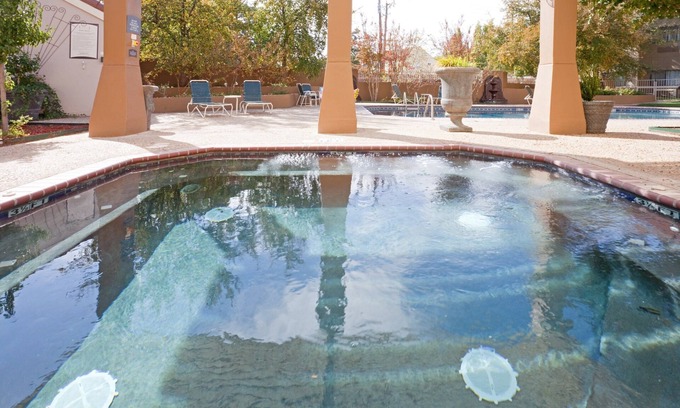 Tech Terrace Condo | King Suite. Shared Pool & Hot Tub. Free Breakfast. Near Texas Tech University & University Medical Center.