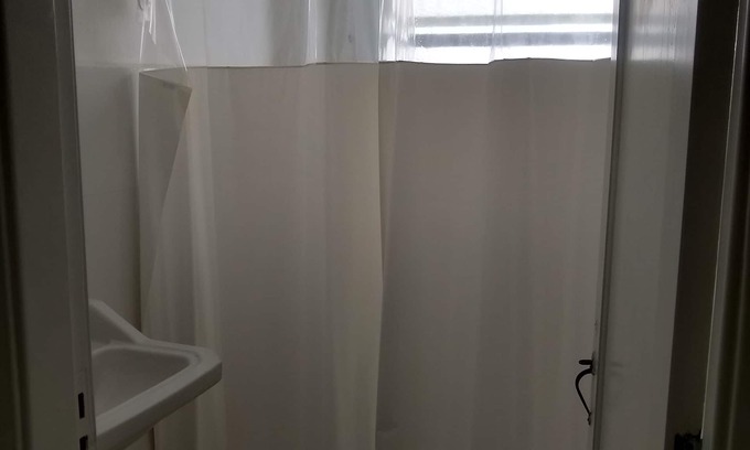 Enseada RV Rental | Kitnet 2 blocks from Enseada beach with Internet