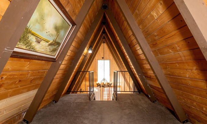 Woodlands Ski Chalet | Knotty Pine Chalet has a huge front deck and fully fenced yard .