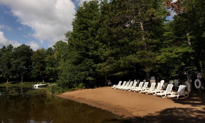 Eagle River Condo | Lake Forest Resort – Relax on a Pristine Sandy Beach in the Northwoods!