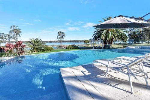 Dora Creek House | Lake Palm Resort Luxury Retreat absolute Waterfront on 3 acres at Lake Macquarie.