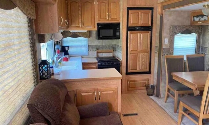 Swanlake House | Lake shore queen bed trailer, tiki torches, & tent space for extra guest