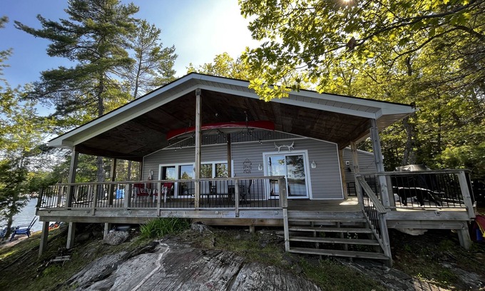 Catchacoma Cottage | Lake view cottage, clean weed free swimming and a hot tub on Mississagua Lake