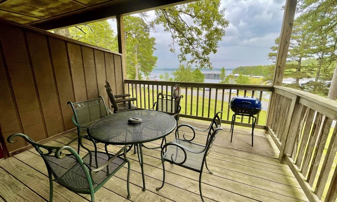 Mount Ida Apartment | Lake view queen guest room with two queens, sleeper sofa and patio overlooking Lake Ouachita. by RedAwning