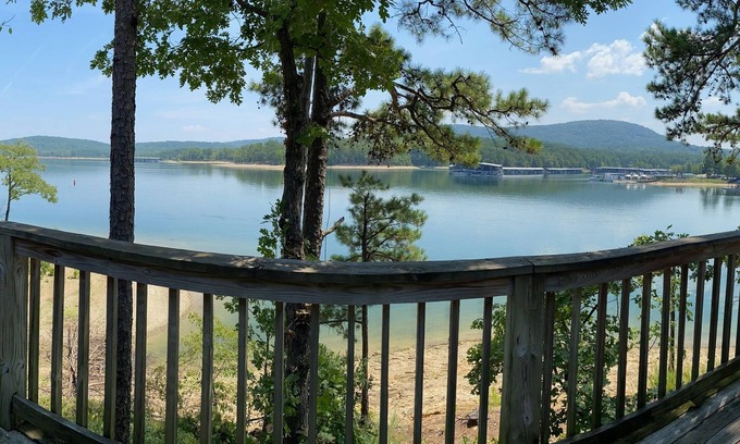 Mount Ida Cottage | Lake view two bedroom, two bath loft, log-sided cottage with private hot tub overlooking Lake Ouachita. by RedAwning
