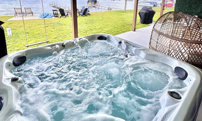 Prudenville House | Lakefront Home: Hot Tub, Paddle Boards, Game Room