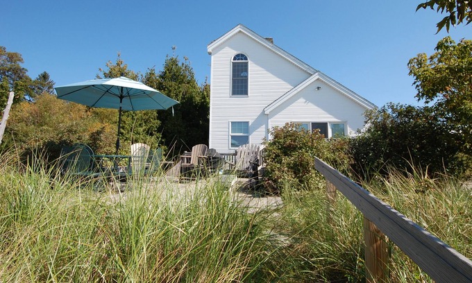 Empire House | Lakefront home with firepit, grill & furnished deck
