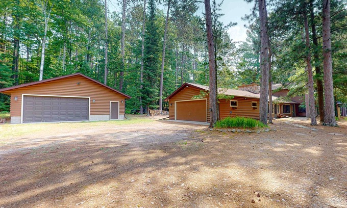 Eagle River House | Lakefront log cabin on Stone Lake w/2 docks, fire place, paddle boat, & WIFI
