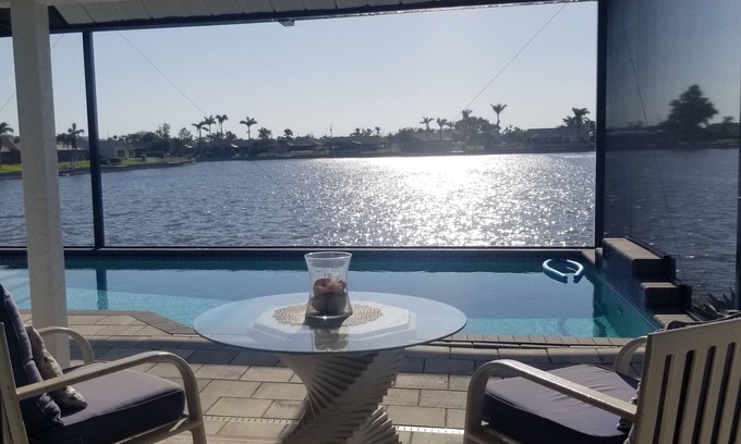 Pelican House | Lakefront Luxury Paradise: 80ft Waterfront, Private Pier & Heated Pool Oasis!