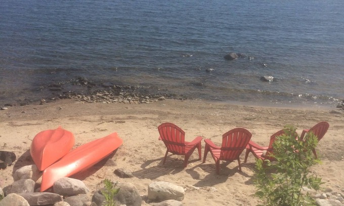 Town of Beekmantown Cottage | Lakefront, private beach, dock, kayaks, Paddle Boat and pet friendly!