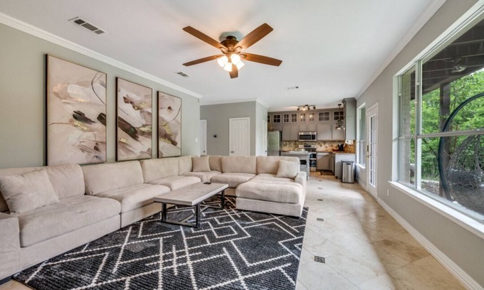 Little Elm House | Lakefront retreat just steps from Lake Lewisville! Enjoy 341 ft of shoreline, a private cove, sandy beach, fire pit, and pergola with built-in grill. Inside: lake views, travertine floors, cozy fireplace, and an upstairs game room with balcony.