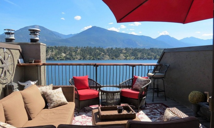 East Kootenay House | Lakefront townhome with outstanding mountain, and lake views and private deck