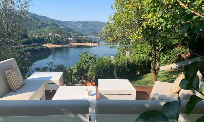 Terras de Bouro Cottage | Lakeside cottage with fireplace, views and terraced gardens