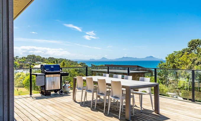 Langs Beach House | Langs Beach House - Modern, sunny holiday home with large decks and stunning views over Bream Bay