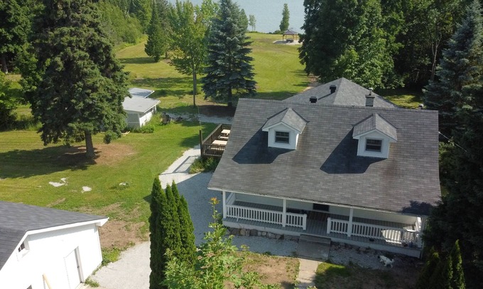 Algoma District Cottage | Large farmhouse style cottage located on three acres of waterfront property.