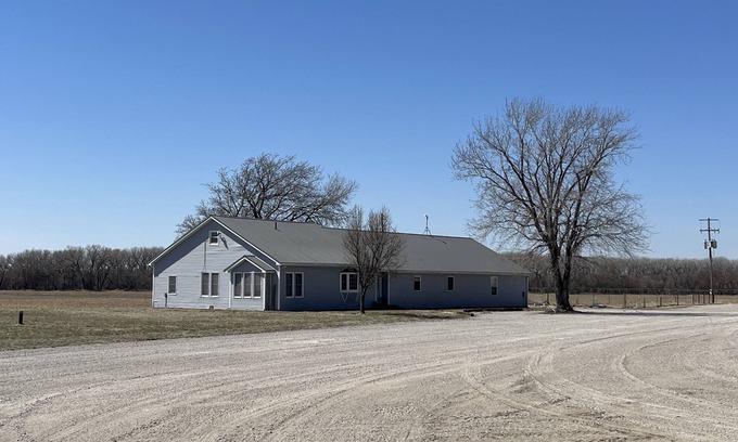 Republic County House | Large house surrounded by farm land along the Republican River.