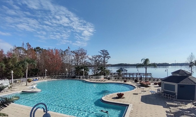 Florida Central Atlantic Coast Condo | LARGE Lakeview Blue Heron CONDO near DISNEY with Balcony & 2 Resort POOLS & SPA