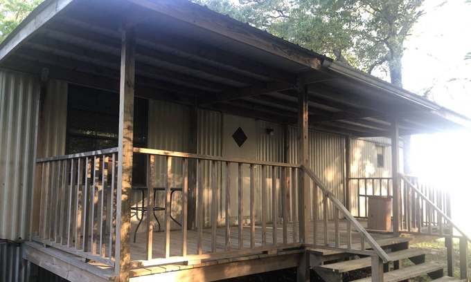 Bastrop House | Large porches overlooking acres of lawn and pasture near lakes and rivers.