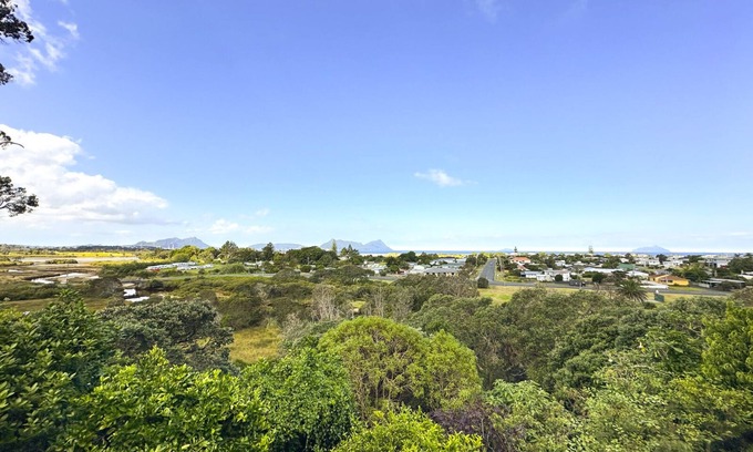 Ruakaka House | Large sunny home with stunning panoramic sea views of Bream Bay