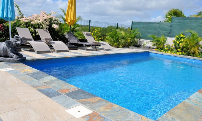 Le Moule Apartment | Lavender apartment, 3 air-conditioned bedrooms, and landscaped swimming pool