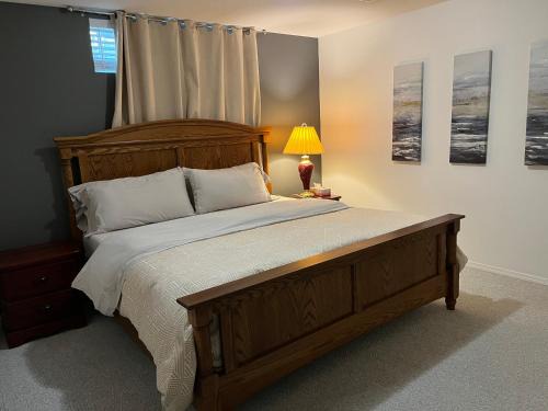 Promontory House | Licensed spacious basement suite with one king-size bed