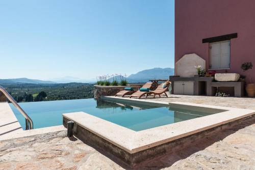 Paidochori Villa | Listen to Nature in a Renovated Traditional Hilltop Villa Liodosifis with Heated Pool
