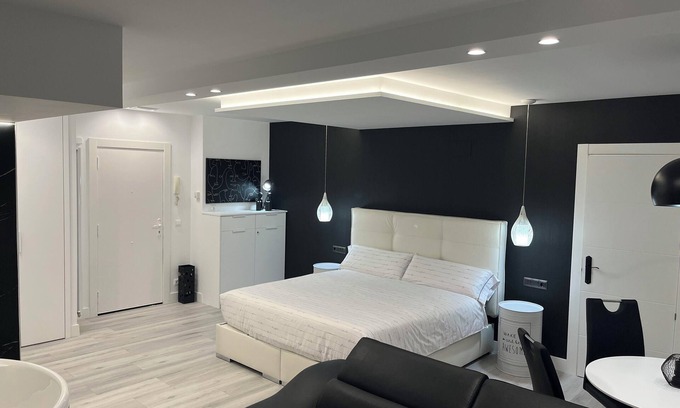 Castro Urdiales Apartment | Loft apartment "Black and White Suite Castro" with Jacuzzi and fireplace.