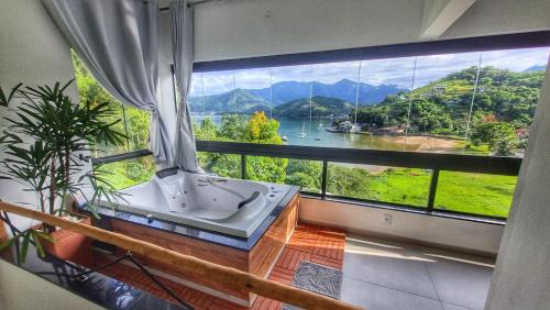 Biscaia Apartment | Loft Praia da Tartaruga com Hidromassagem