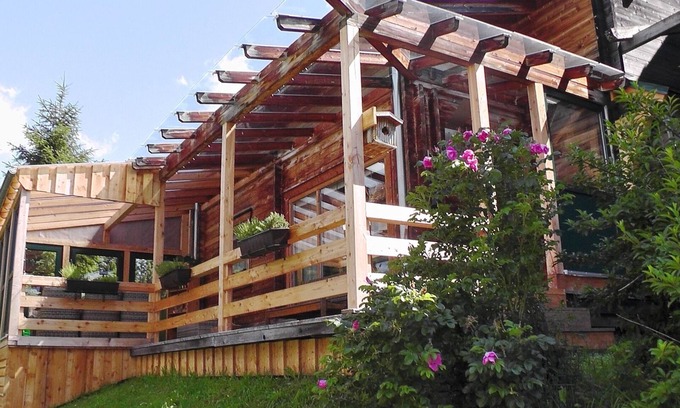 Hohentauern House | Log cabin with breathtaking mountain views through the changing seasons