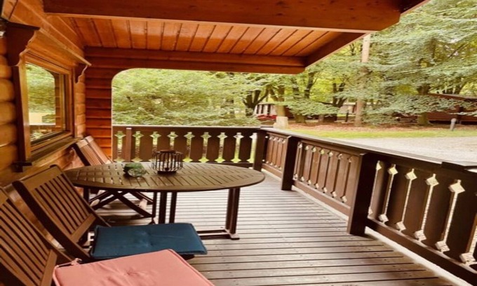 Kenwick Cabin | Log cabin with veranda, nestled in Kenwick Park, Louth