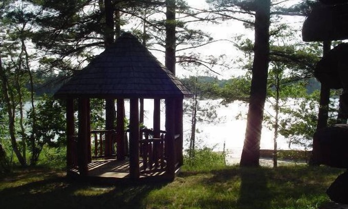 Gaylord House | Log Home On Wequas Lake, snowmobile trails & parking, near skiing, dog-friendly