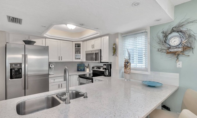 Indian Shores Condo | Lovely condo steps to beach…wow sunsets.