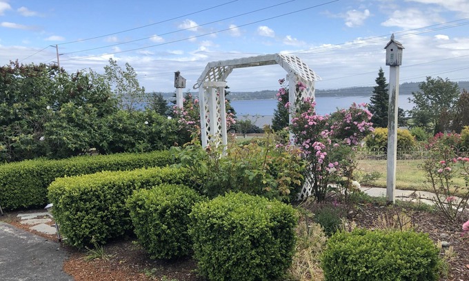 Oak Harbor Cottage | Lovely water and garden views. Two minutes drive to beaches, six to either town!