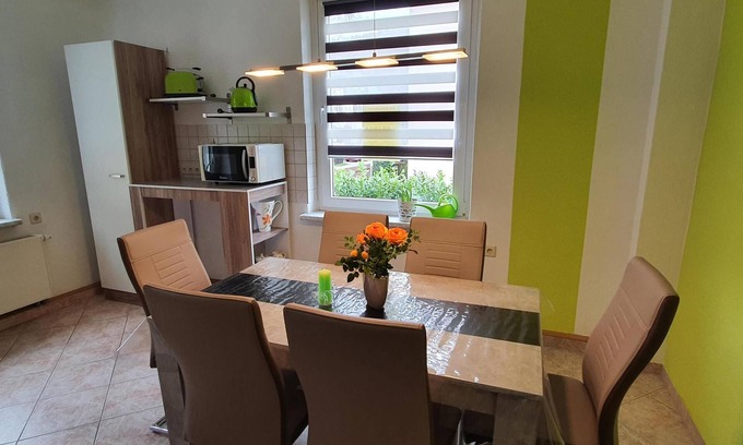 Schwarzenberg/Erzgeb. Apartment | Lovingly furnished, new vacation apartment with washing machine, large kitchen, large bathroom with shower and bathtub, parking space, box spring bed.