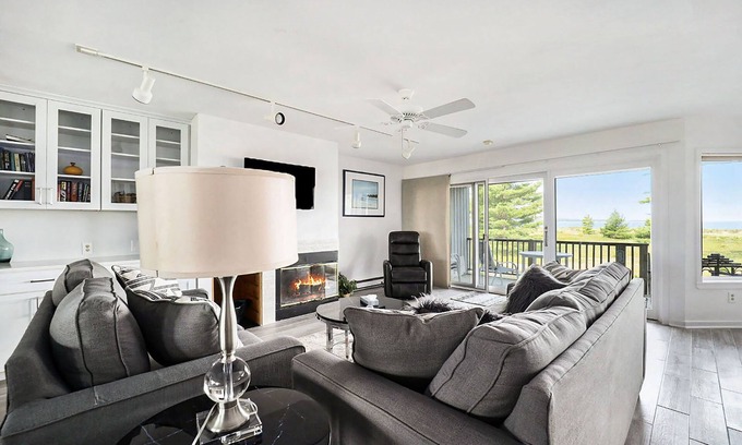 Glen Arbor Condo | Lower-level beachfront condo with deck, lake views, washer/dryer, fireplace