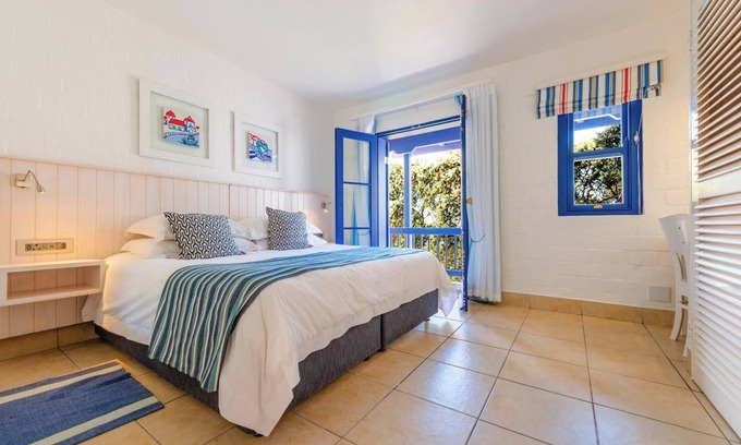 Mykonos Apartment | Luxe Beachside Retreat | Patio | Resort Perks