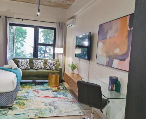 Sandown Apartment | Luxe Sandton Suite Rooftop Pool and Sandton Skyline